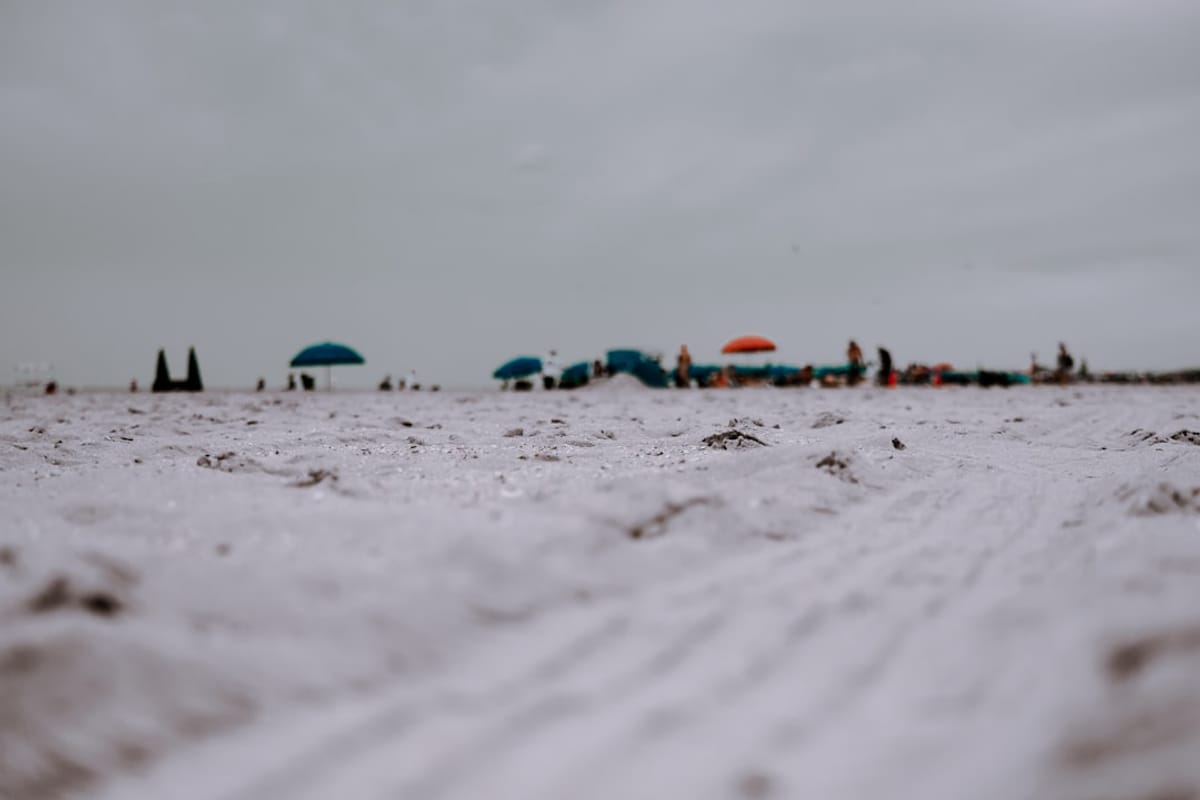 Coral Gables Apartments | Sunless Fun in Florida Coral Gables Apartments | Quiet winter beach with umbrellas