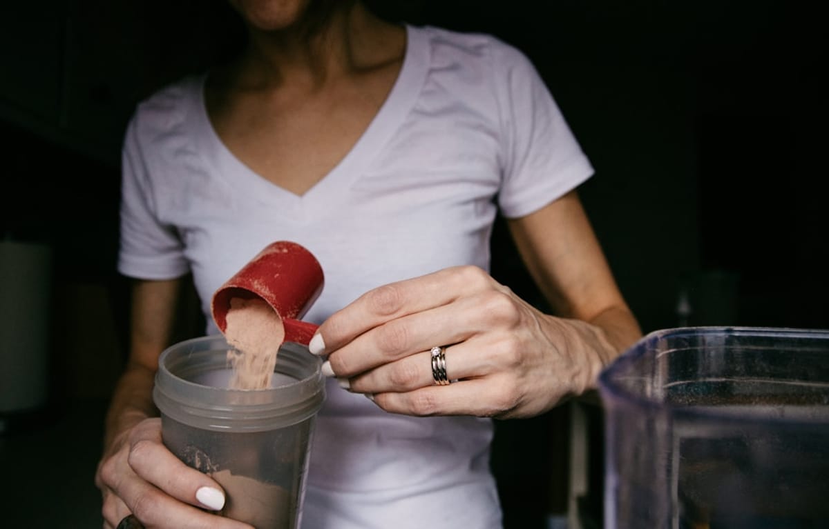 Planet Fitness in Little Havana  Planet Fitness in Little Havana | woman Making a Protein Drink