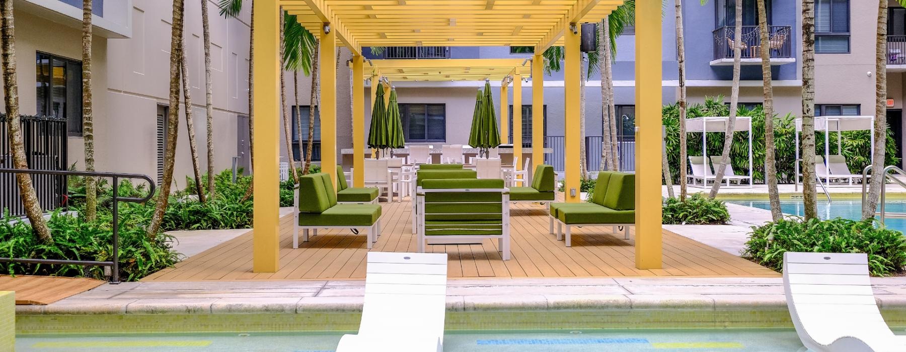 a swimming pool in front of a building