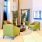 a lobby with green furniture