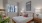 a bedroom with a bed and a plant