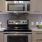 a kitchen with a microwave oven and cabinets