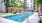 a swimming pool in front of a building