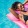 a woman laying in the pool on a float