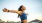 a woman with her arms out wide