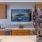 a kitchen with a large television